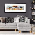 Grey and black pillows on comfortable corner sofa in fashionable